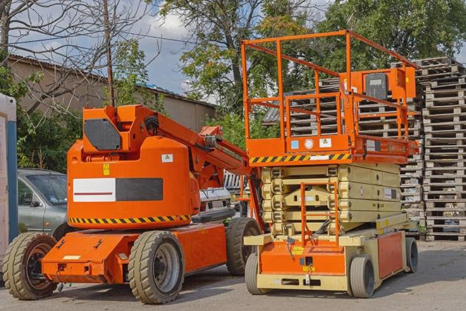 worker using forklift in industrial warehouse in Alpine